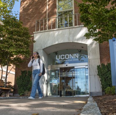 Exterior views of the School of Social Work (SSW) with students walking out of the building. Sept. 15, 2022. (Sean Flynn/UConn Photo)